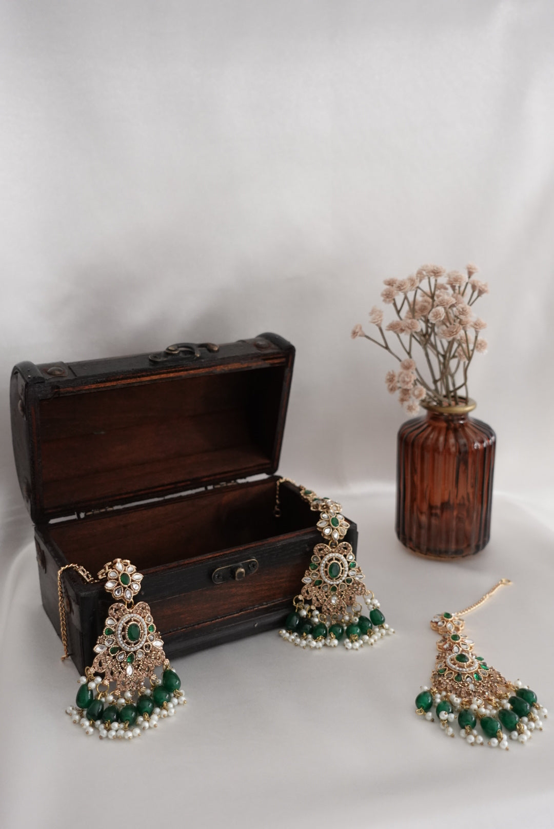 Indian/Pakistani jewelry set with tikka and earrings on a white background. Royal 